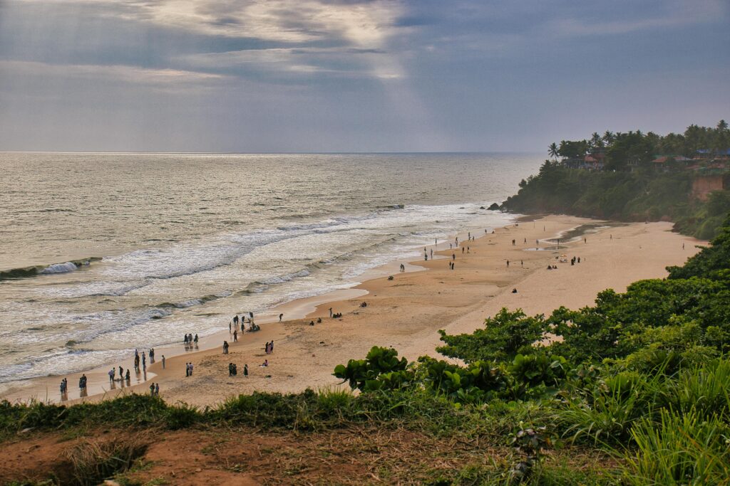 Relax and unwind with this scenic view of Varkala Beach in Kerala at sunset.